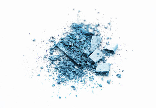 Makeup cosmetics. Eyeshadow crushed palette, colourful eye shadow powder on light background