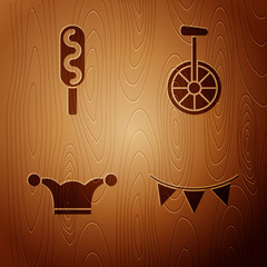 Set Carnival garland with flags, Corn dog, Jester hat with bells and Unicycle or one wheel bicycle on wooden background. Vector © Oksana