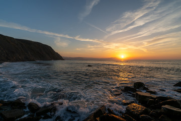 Nightfall on the beach of Barrika, a magical place on the coast of the Basque Country, a natural paradise