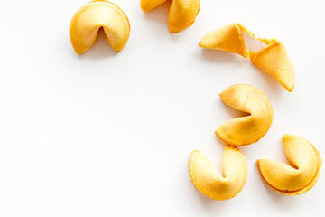Traditional fortune cookies on white table top-down copy space