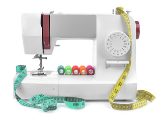Modern sewing machine on white background