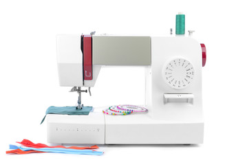 Modern sewing machine on white background