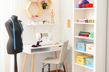 Interior of modern atelier with tailor's workplace