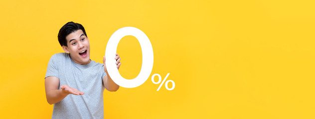 Young handsome Asian man offer 0% on banner background