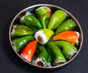 Tray of raw stuffed peppers with rice. Home made food. Ready to bake. - 315575675