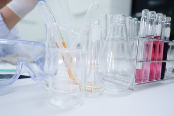 Cropped shot view of  the equipment and science experiments in Laboratory, Chemical substances for research and analyzing a sample under the microscope in laboratory.   