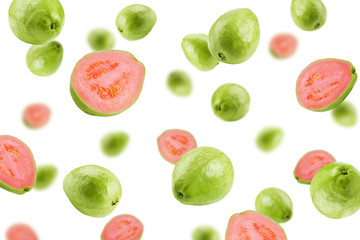 Falling guava isolated on white background, selective focus
