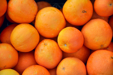 ripe oranges in a box