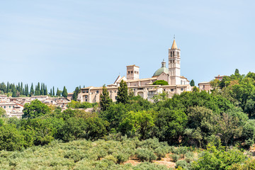 Town village city of Assisi in Umbria, Italy cityscape of church bell tower during sunny summer day...