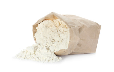 Overturned paper bag of flour isolated on white