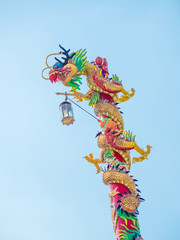 Sky blue have mask dragon demon monster  icon red, green gold color on roof churches and temple and float lamp lanterns is happy chinese new year asia culture decoration shanghai and thailand buddhism