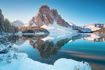 First snow Morning at Lake in Mount Assiniboine Provincial Park Canada Snow-covered winter mountain lake in a winter atmosphere. Nature in Rocky mountains. Beautiful background photo concept. - Powered by Adobe