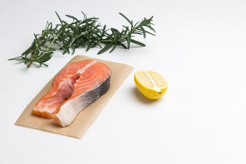 Fish steak,  fresh raw salmon.  Rosemary lemon. Red fish source omega -3.
