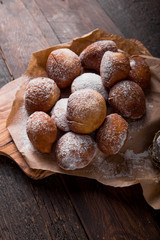 Bunuelos (Mexican fritters) golden, crispy-sweet, tortilla-like fritters. pile of bunyols de Quaresma, typical pastries of Catalonia, Spain, eaten in Lent