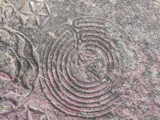 Old islamic tomb stone at old cemetry with writings.