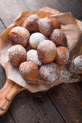 Bunuelos (Mexican fritters) golden, crispy-sweet, tortilla-like fritters. pile of bunyols de Quaresma, typical pastries of Catalonia, Spain, eaten in Lent