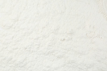 Pile of organic flour as background, top view