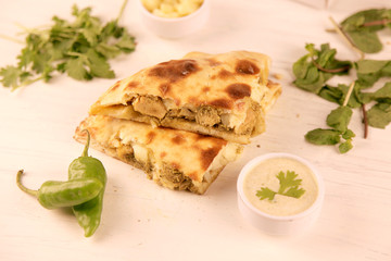 Healthy Stuffed naan desi pizza with Chicken herbs vegetables and Cheese