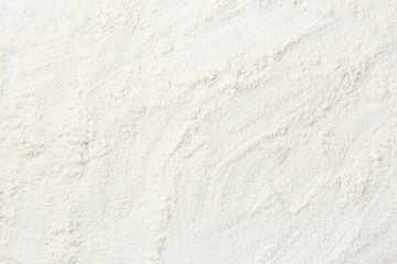 Fototapeta na wymiar Pile of organic flour as background, top view