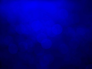 Abstract bokeh festoon on dark blue background.bokeh blurry background.