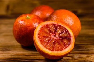 Ripe sicilian oranges on a wooden table