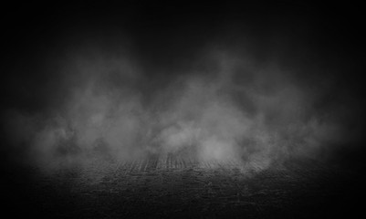 Dark street, wet asphalt, reflections of rays in the water. Abstract dark blue background, smoke, smog. Empty dark scene, neon light, spotlights. Concrete floor