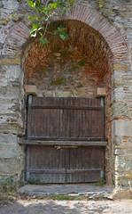 An old wooden door in the grounds of the 15th century Rumeli Hisari fort in the Sariyer district of Istanbul, Turkey