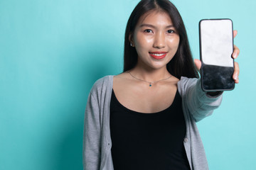 Young Asian woman with mobile phone.