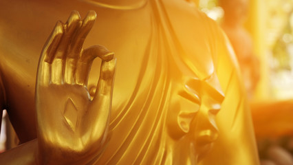The hand of the Buddha statue is a Buddhist statue.