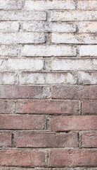 the brick is old painted and the paint