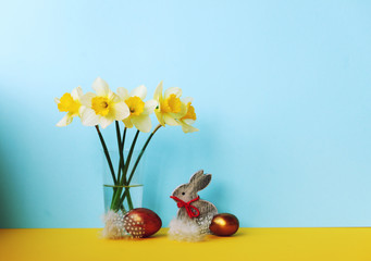 Easter  background with daffodils and eggs,nest,bunny