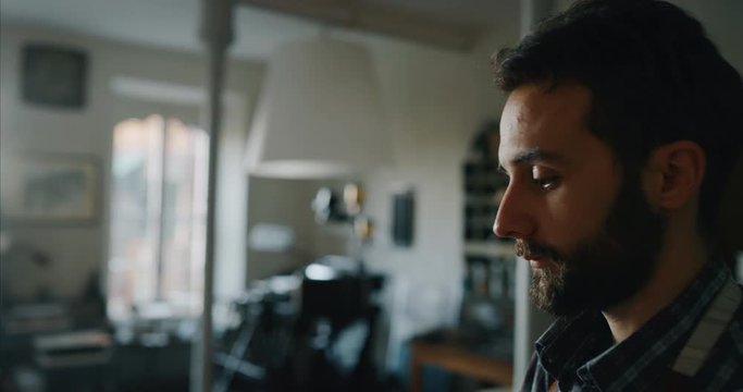 Slow motion of an artisan papermaking master is putting to dry high quality handmade paper sheet in a workshop. Shot in 8K. Concept of handmade,high quality,artisan, made in Italy,tradition