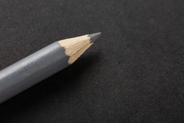 gray pencil on a gray background top view.