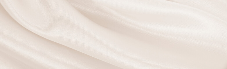 Smooth elegant golden silk or satin luxury cloth texture as wedding background. Luxurious...