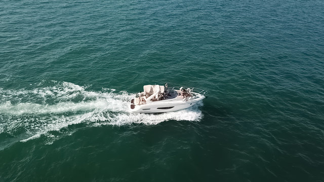 View Of A Private Recreational Boat With People Sailing