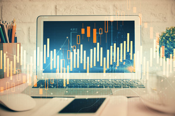 Forex Chart hologram on table with computer background. Double exposure. Concept of financial markets.