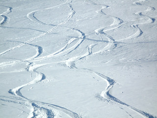 ski and snowboard track in powder snow with copy space for your text