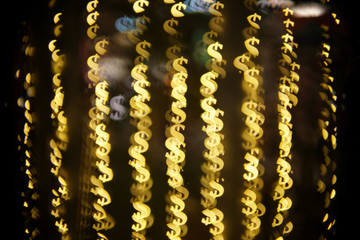 Dollar bokeh lights. Abstract financial background with many dollar symbols.
