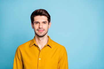 Fototapeta premium Photo of attractive brunet haired business man standing confidently near empty space isolated over pastel color background