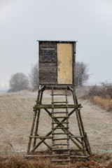 Wooden Hunters hunting tower in winter with snowfall, countryside landscape, Czech Republic,...
