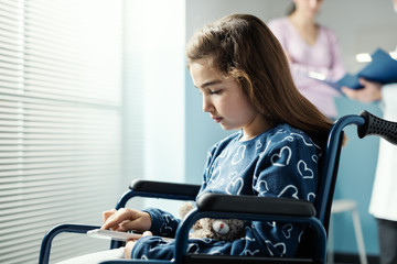 Girl in wheelchair at the hospital