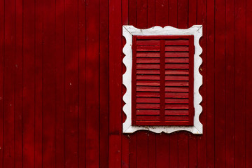 painted old wooden wall. red background