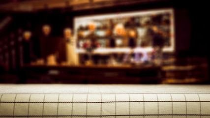 desk of free space for your decoration and blurred bar background. 