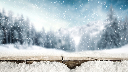Desk of free space for your decoration cover of snowflakes and winter landscape of mountains. 