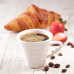 coffee cup, croissant and strawberry