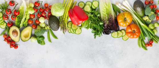 Banner, long photo, fresh raw ingredients tomatoes cucumbers lettuce pepper avocado parsley spring peas on the white table, top view, copy space, selective focus