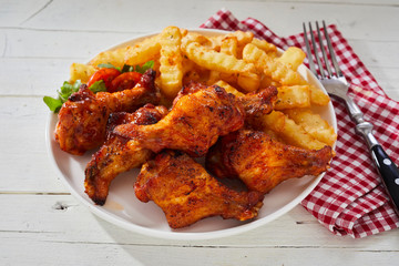 Spicy crumbed chicken wings with French Fries