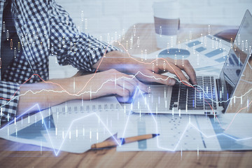 Multi exposure of stock market chart with man working on computer on background. Concept of financial analysis.