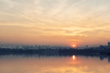 Sunset over an industrial city