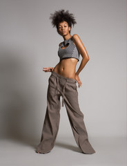 African girl posing in loose pants 